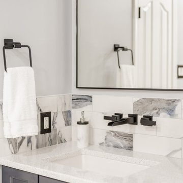 Bathroom remodeling in Columbia, MD with double vanity & marble bathtub