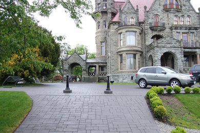 Inspiration for a mid-sized timeless four-story house exterior remodel in Other
