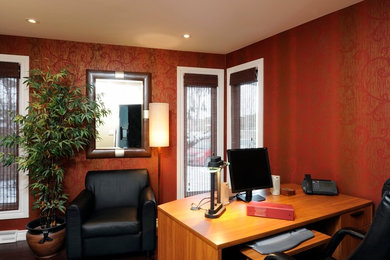 Photo of a mid-sized eclectic home office in Ottawa with dark hardwood floors and a freestanding desk.