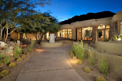 Design ideas for a contemporary garden in Phoenix with a water feature.