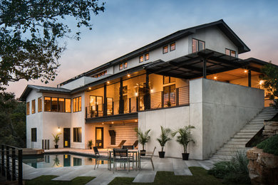 This is an example of a contemporary white exterior in Austin with a gable roof.