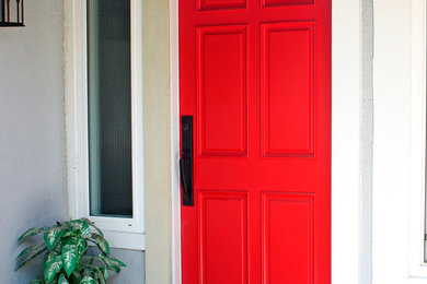 Inspiration for a traditional front door with a single front door and a dark wood front door.