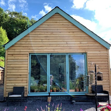 Extension with timber cladding on 1900 Century cottage in Pentir, North Wales