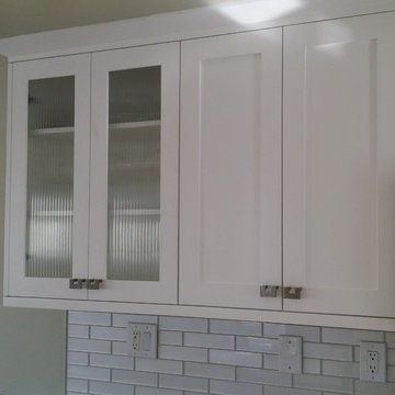 Kitchen Renovation of cabinets with full overlay and counter tops.