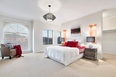 This is an example of a mid-sized transitional master bedroom in Melbourne.