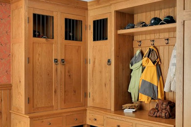 Large elegant slate floor mudroom photo in Boston with brown walls