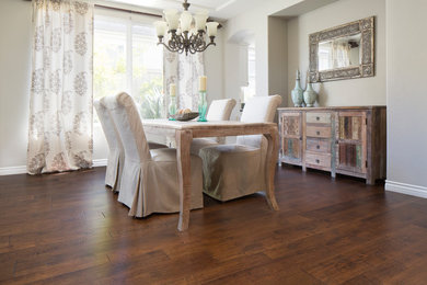 Inspiration for a mid-sized traditional kitchen/dining combo in San Diego with grey walls and medium hardwood floors.