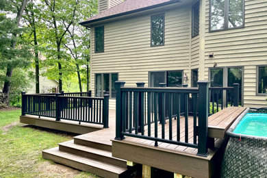 Deck - large backyard ground level deck idea in Chicago