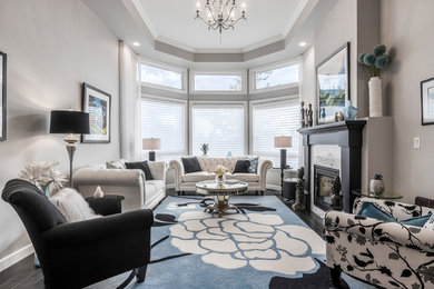 Inspiration for a mid-sized transitional formal and open concept dark wood floor and brown floor living room remodel in Vancouver with gray walls, a two-sided fireplace, a tile fireplace and no tv