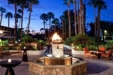 Inspiration for a mediterranean patio remodel in San Diego with a fire pit