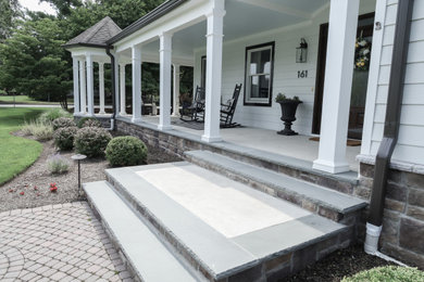 Example of a trendy white concrete fiberboard exterior home design in New York