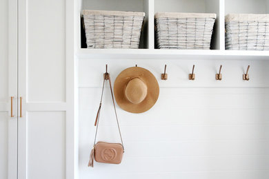 Inspiration for a mid-sized contemporary medium tone wood floor front door remodel in Toronto with white walls