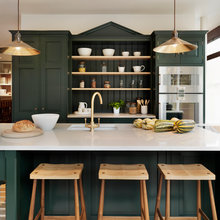 Green kitchen with silver oven