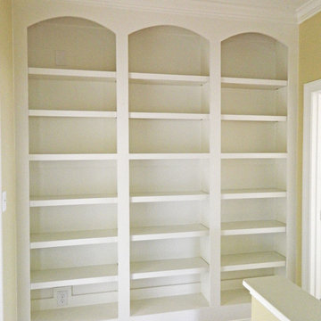 Custom Built-in Bookcase with Arch Detailing and Adjustable Shelves