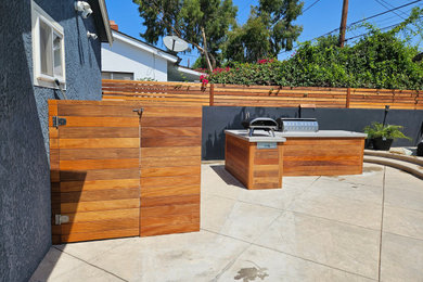 Inspiration for a contemporary backyard patio kitchen remodel in Los Angeles