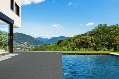 Example of a minimalist backyard pool design in Other