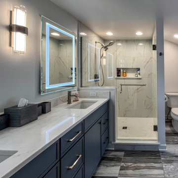 Primary Suite Remodel with Blue Cabinetry and Calacatta Miraggio Duo Quartz