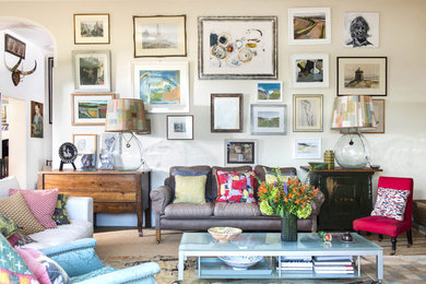 Eclectic living room in Dorset with beige walls, carpet and brown floor.