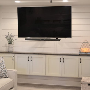 Inspiration for a large farmhouse look-out basement in Detroit with grey walls, vinyl flooring and grey floors.