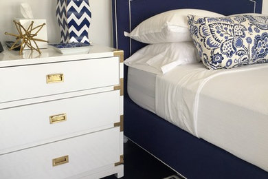 Inspiration for a large transitional guest dark wood floor bedroom remodel in New York with white walls and no fireplace