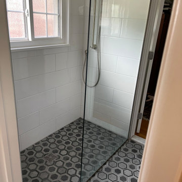 Alexandria barrier free shower and wall mount vanity bathroom remodel