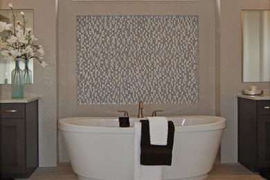 Huge elegant master beige tile and ceramic tile ceramic tile bathroom photo in Boise with flat-panel cabinets, dark wood cabinets, a one-piece toilet, beige walls, an integrated sink and granite countertops
