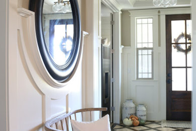 Example of a country medium tone wood floor, brown floor and wall paneling hallway design in Denver with white walls