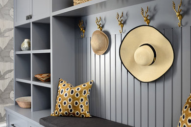 Inspiration for a transitional gray floor mudroom remodel in Toronto with gray walls