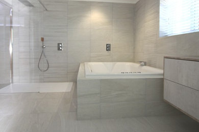 Design ideas for a contemporary sauna bathroom in Essex with a hot tub, a walk-in shower, grey tiles and an open shower.
