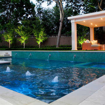 Transitional Outdoor Pool with Cabana and Fireplace