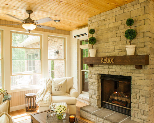 Landhausstil Wintergarten mit Kaminsims aus Stein Ideen, Design