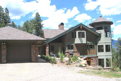 Example of a mid-sized arts and crafts multicolored split-level vinyl exterior home design in Other