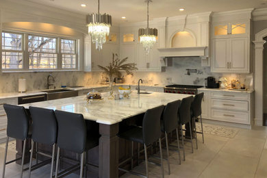 Inspiration for a timeless beige floor eat-in kitchen remodel in New York with beaded inset cabinets, white cabinets, stainless steel appliances and an island