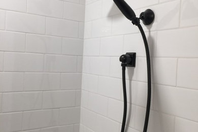 Example of a small minimalist 3/4 white tile and subway tile marble floor and gray floor bathroom design in DC Metro with furniture-like cabinets, white cabinets, a two-piece toilet, gray walls, an undermount sink, marble countertops and gray countertops