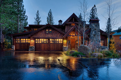 Large mountain style brown two-story wood exterior home photo in Sacramento