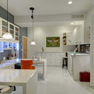 Design ideas for a mid-sized transitional craft room in Denver with grey walls, porcelain floors, no fireplace, a built-in desk and white floor.