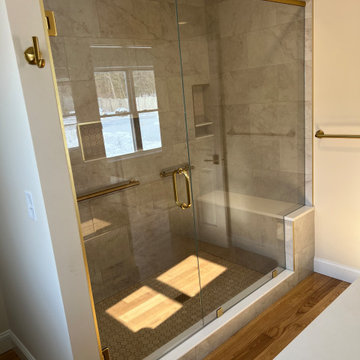 Frameless Glass Shower with Gold Hardware