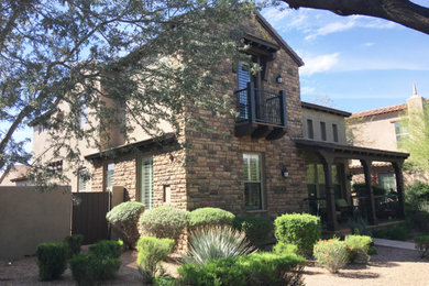 Mid-sized traditional beige two-story stucco exterior home idea in Phoenix