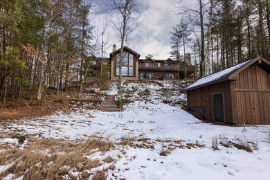 Example of a mountain style home design design in Other