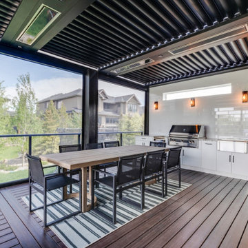 Adjustable StruXure Pergola Featuring Outdoor Kitchen With Screens & Heaters