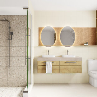 Ispirazione per una piccola stanza da bagno padronale minimalista con ante con bugna sagomata, ante in legno scuro, WC monopezzo, piastrelle gialle, piastrelle in gres porcellanato, pareti gialle, pavimento in gres porcellanato, lavabo a bacinella, top in quarzo composito, pavimento beige, top rosa, due lavabi e mobile bagno sospeso