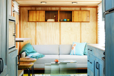 Example of a small trendy formal and enclosed painted wood floor living room design in Seattle with beige walls, no fireplace and no tv