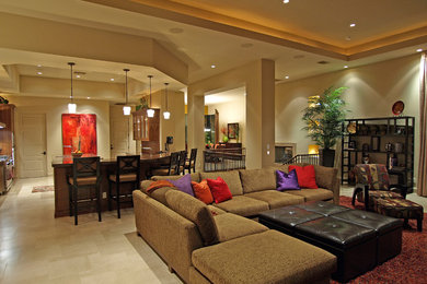 Family room - large transitional open concept porcelain tile family room idea in Las Vegas with beige walls and a wall-mounted tv
