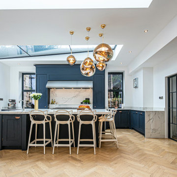 An impressive handmade shaker-style kitchen that is the social hub of the home