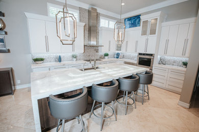 Open concept kitchen - large transitional l-shaped marble floor and beige floor open concept kitchen idea in Miami with an undermount sink, shaker cabinets, white cabinets, quartzite countertops, gray backsplash, marble backsplash, stainless steel appliances, an island and white countertops