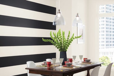 Inspiration for a contemporary dark wood floor and brown floor dining room remodel in Philadelphia with multicolored walls