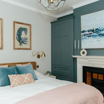 Soft pink and blue master bedroom with recessed storage