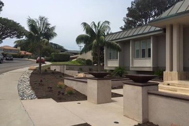 Mid-sized southwest gray one-story mixed siding exterior home photo in San Diego with a clipped gable roof