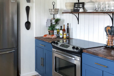 Inspiration for a country kitchen remodel with shaker cabinets and blue countertops
