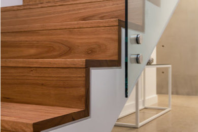 Design ideas for a contemporary wood straight staircase in Adelaide with wood risers.